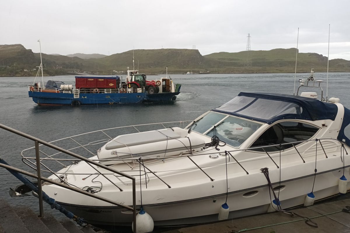 Back safely: the moored up motorboat saved from hitting rocks at Cuan after the Belnahua ferrycrew and two fishermen rescued it.