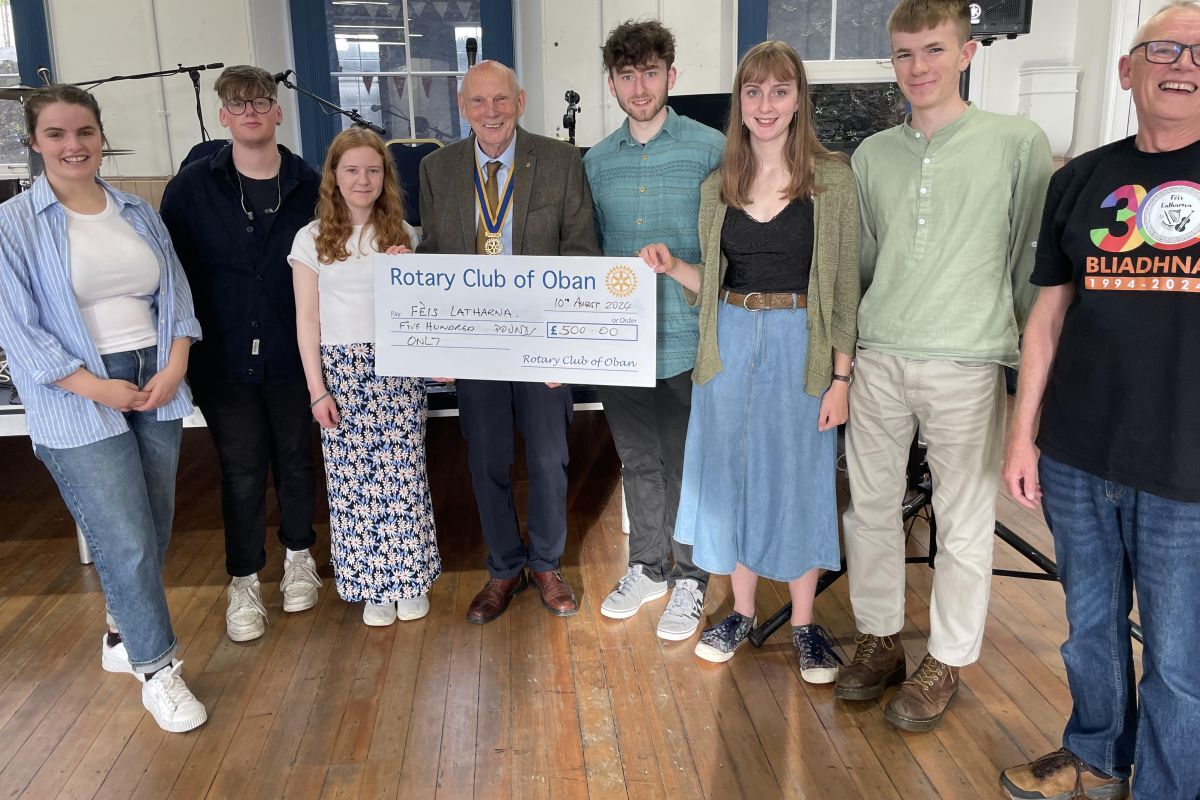 Rachael Campbell, Owen Stark, Fiona Cruickshanks, President Peter Tosh, Gregor Niven, Edie Elliot, Dylan Howe and Davy MacDonald at the Rotary Club's cheque presentation.