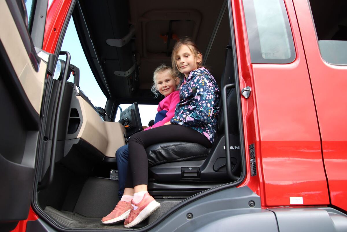 Eight-year-old Julia Skibińska and big sister Pola, nine, enjoyed spraying the hose on the airport fire tender. Photograph: Kenny Craig.