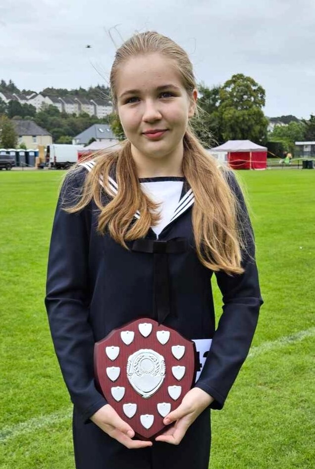 Intermediate section champion Ava Ross with her trophy. Intermediate section champion Ava Ross with her trophy.