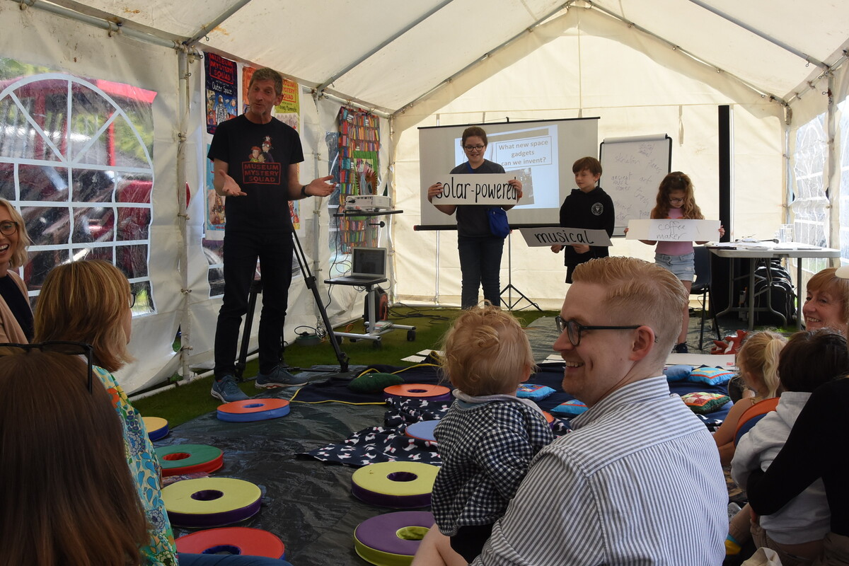 Author Mike Nicolson entertains children at Wee Mac Arran with a word game.