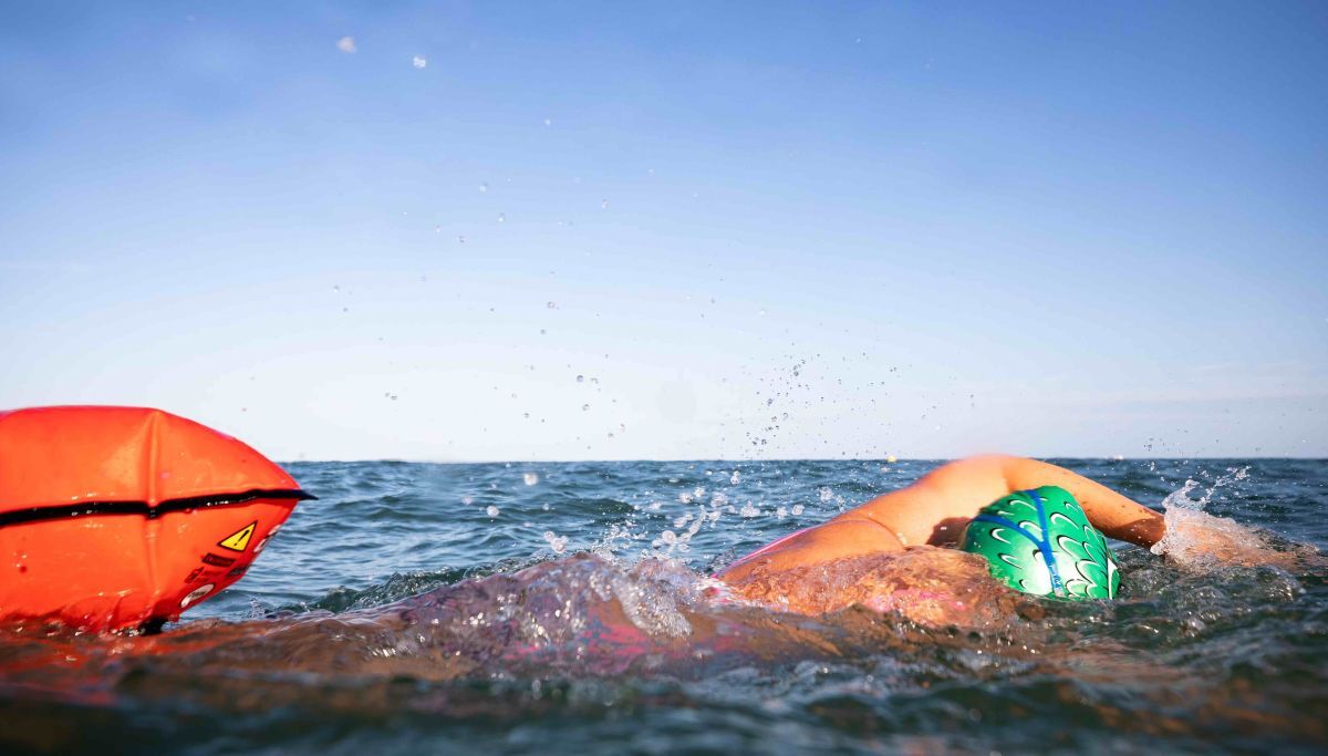 Stay visible in the sea - a brightly-coloured hat and a tow float helps. Photograph: RNLI/Nathan Williams.