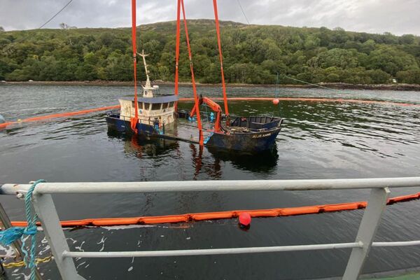 Sunken fish farm boat raised off Mull