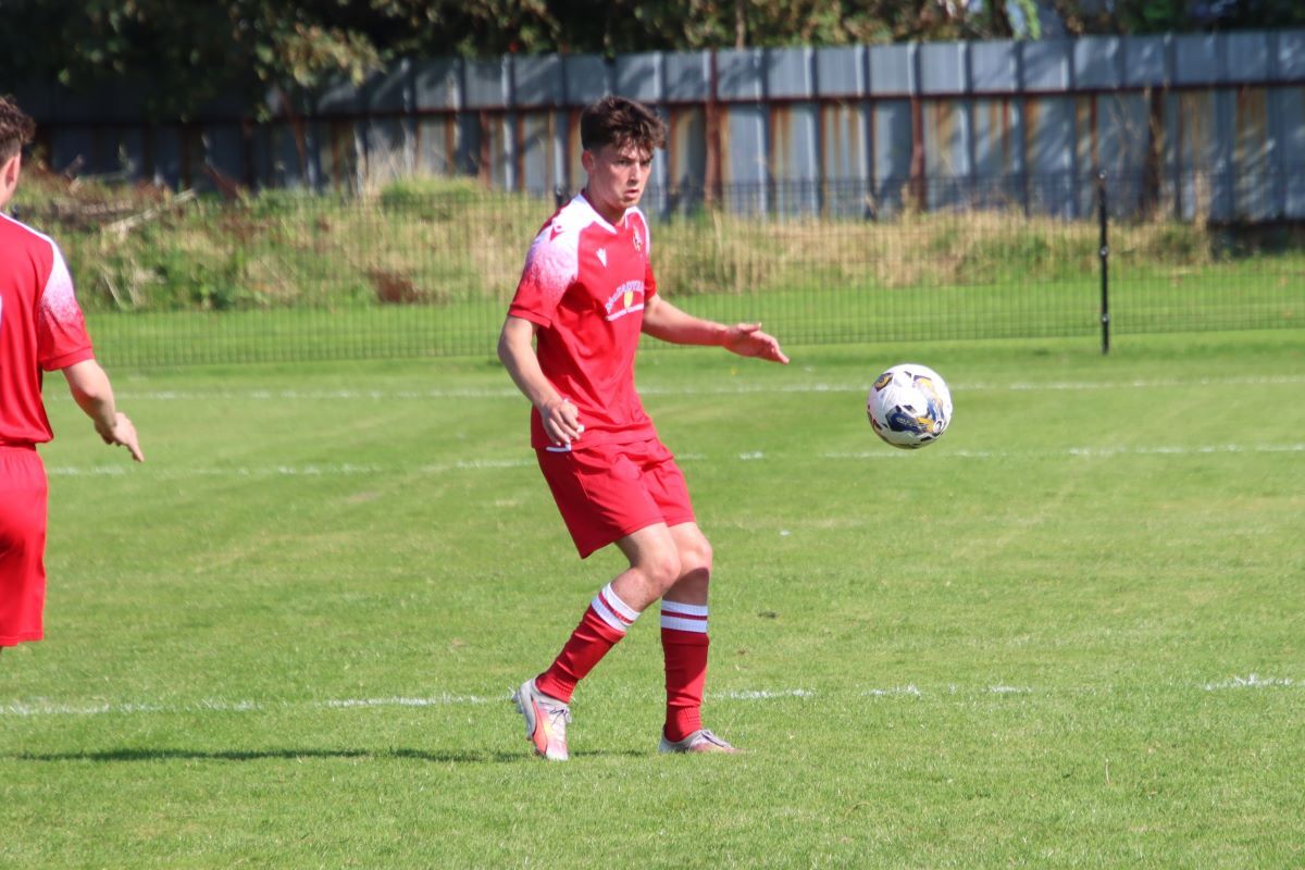 Pupils goalscorer Finlay Bainbridge keeps his eye on the ball.