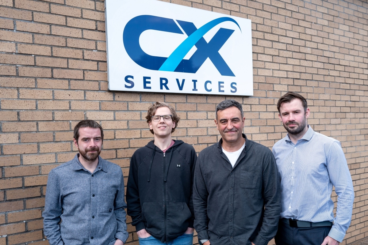 CX Services Operations Director Andy Hore, Print Apprentice Riley Macrae-Duffy, Managing Director Greg Girard and Technical Services Director John Lamont. Photograph: CX Services