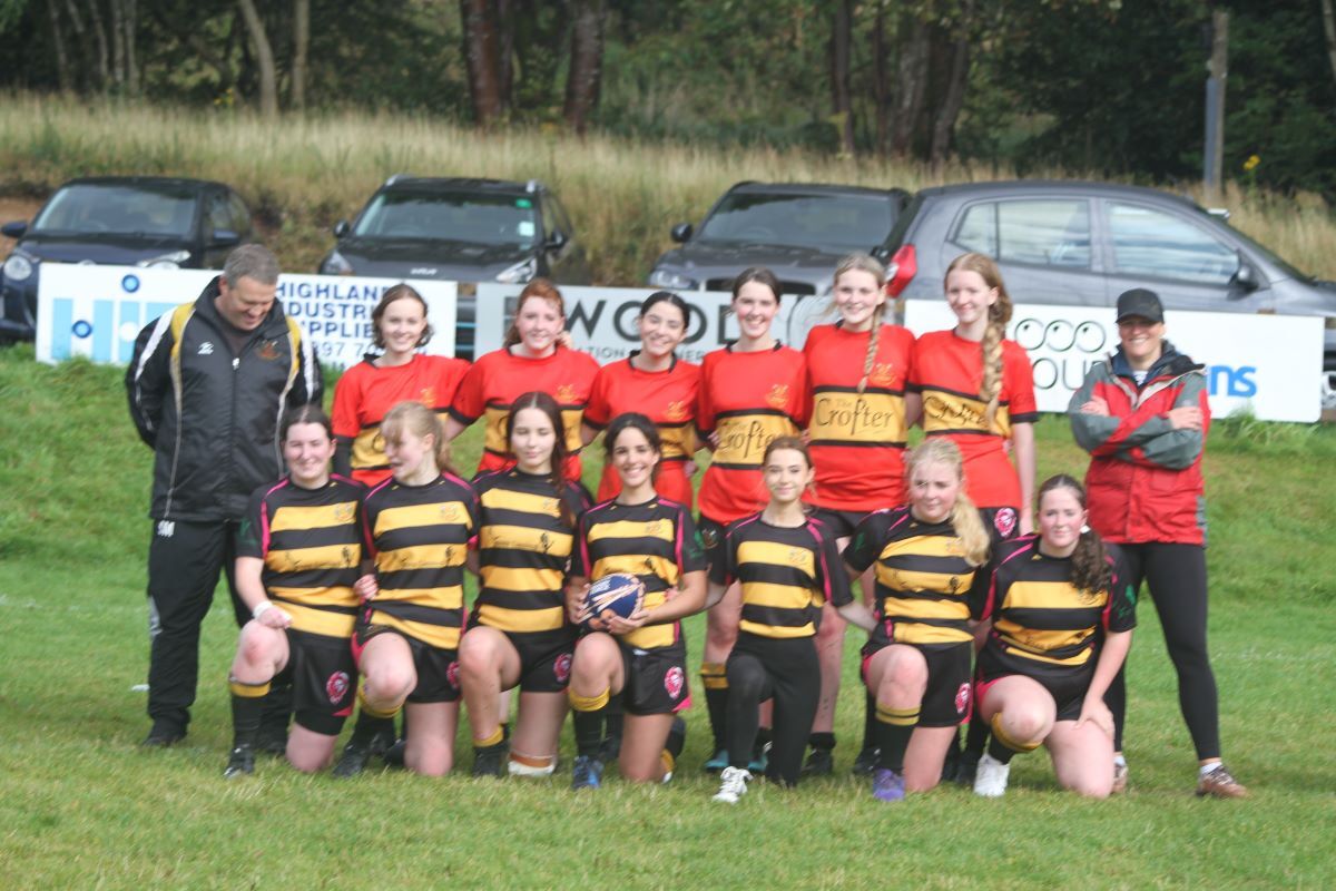 Lochaber Rugby Club's Under 16 and Under 18 girls with their coaches.