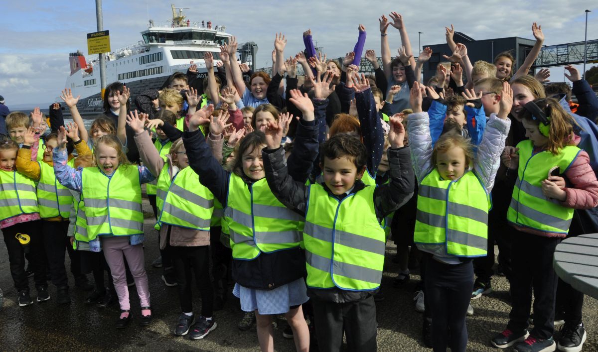 Happy to see you. Brodick Primary School pupils went to the pier to welcome the Glen Sannox on her first visit to Arran.