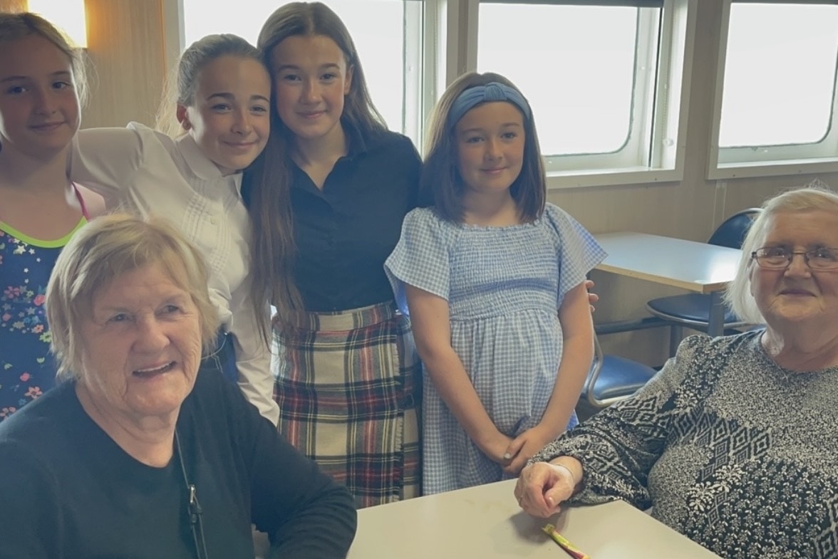 Mid Argyll girls on their way home from the Mull Mod in 2023 with tutors Christine Johnston and Josie Campbell.