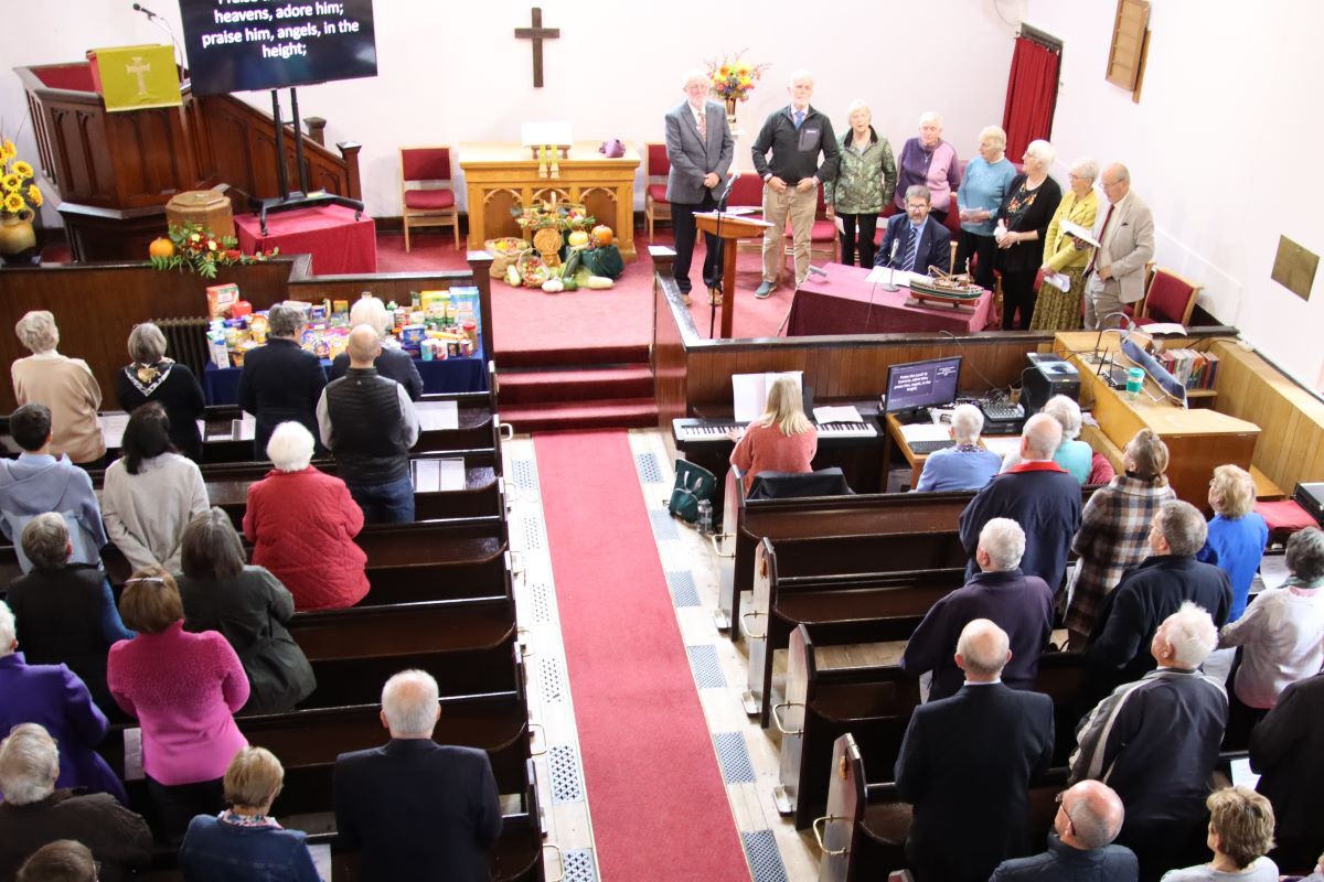 Church group harvests goods for food bank