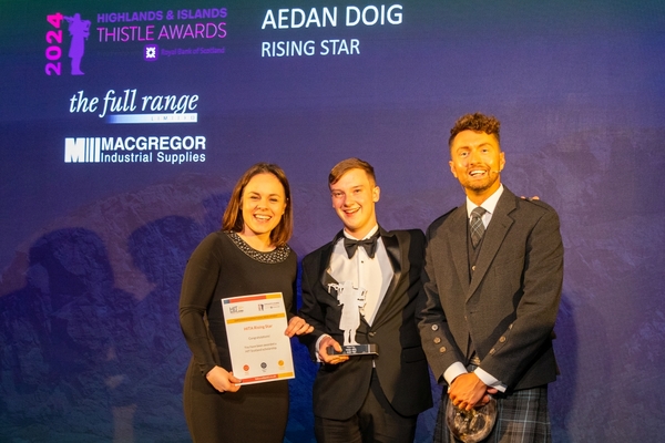 Aedan Doig received the Rising Star award from Deputy First Minister Kate Forbes and TV weatherman and presenter Sean Batty . Photograph: Martin Parker Photography