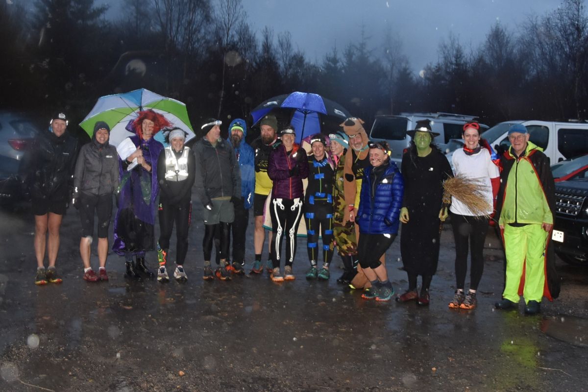 Fancy dress runners in the pouring rain before the race started.