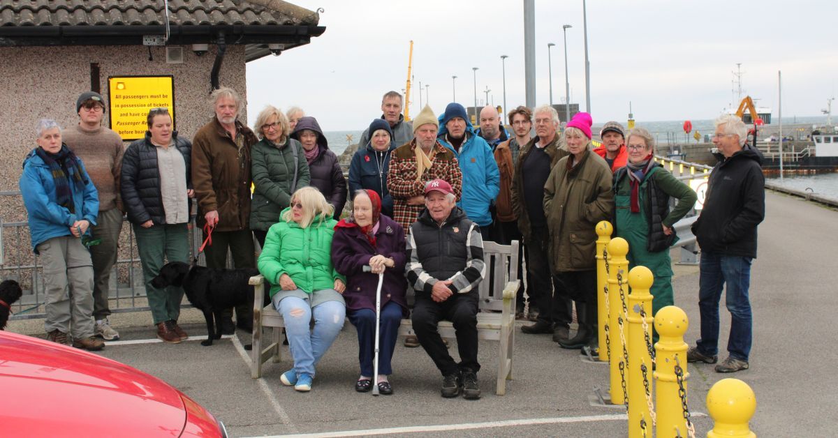 Campaigners against losing their Monday ferry gather at Colonsay pier in protest. 