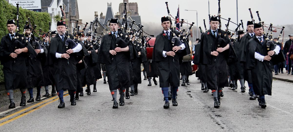 Members of Oban Pipe Band and Oban High School Pipe band lead the Remembrance Day parade to the war memorial along the seafront. Photograph: Kevin McGlynn