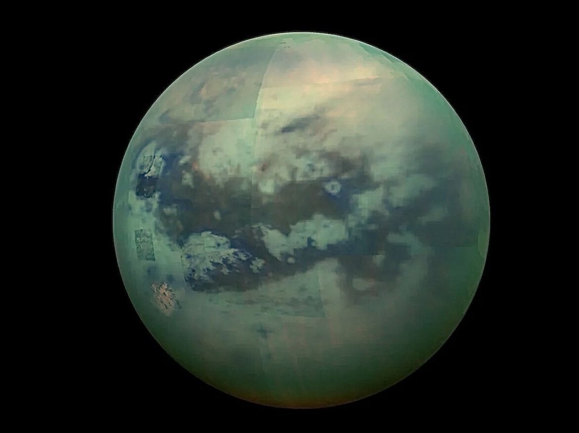 A spacecraft photo of Saturn’s moon Titan with its lakes and seas. A spacecraft photo of Saturn’s moon Titan with its lakes and seas.