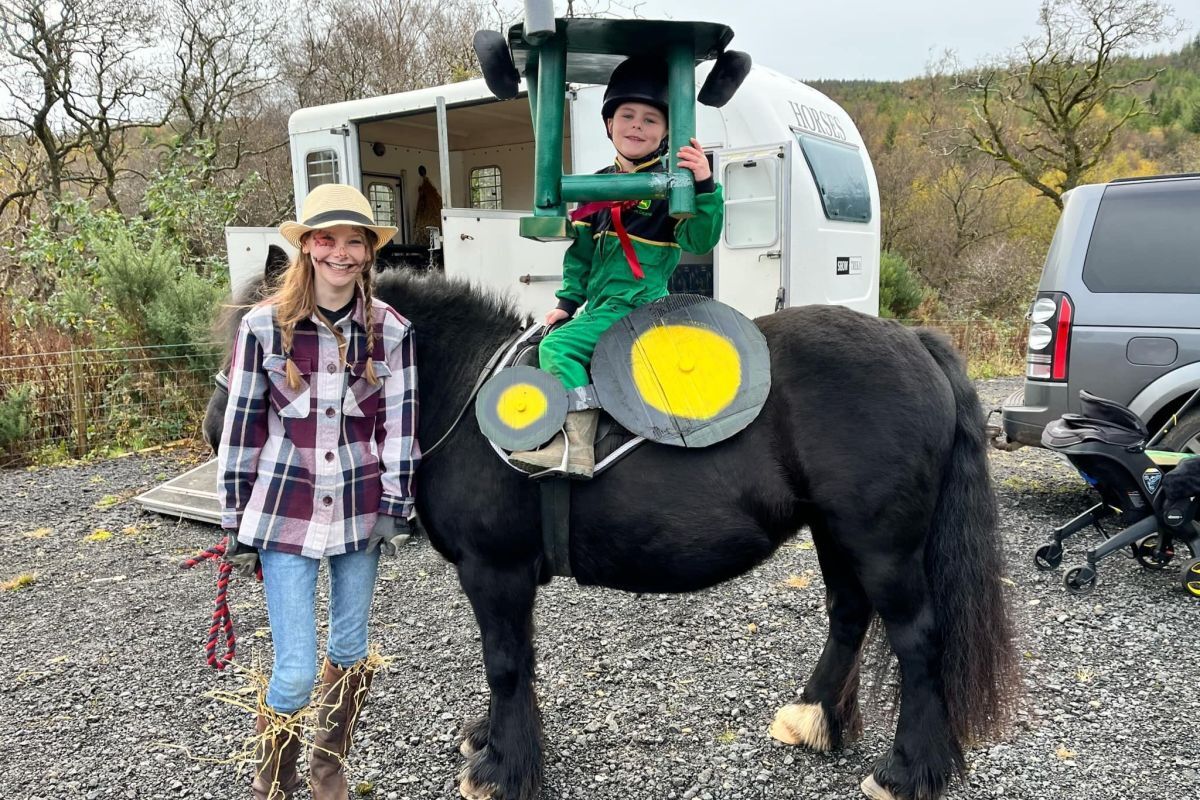 Winners of the fancy dress costume Innis McNeil and pony Bear as tractor and driver. Photograph: ARC.