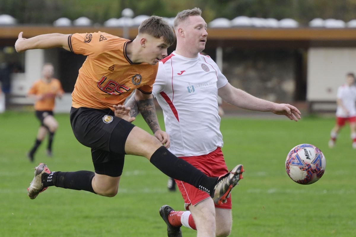 Liam Martin in the air again as he aims for the Halkirk goal. Photograph: Iain Ferguson, alba.photos 