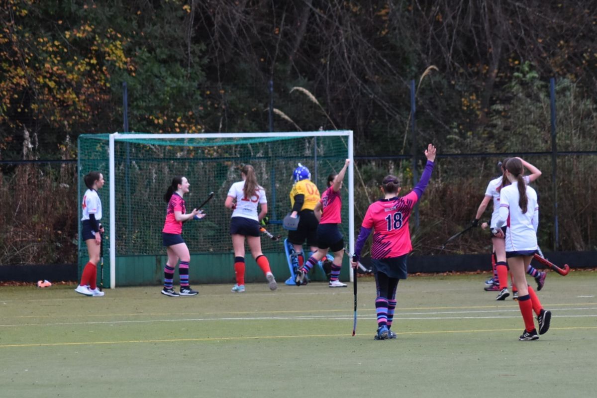 The Arran Ladies hockey team celebrate scoring a goal.