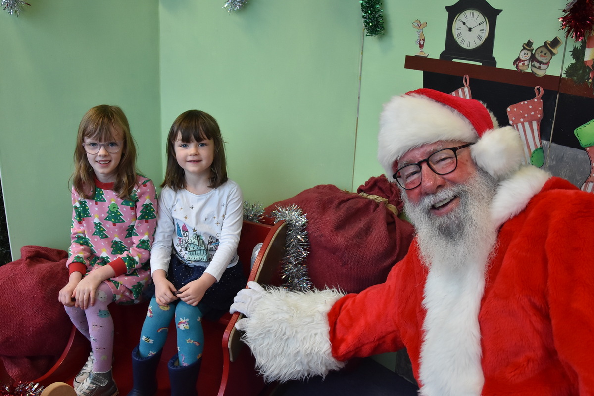 Betty and Daisy Fleming meet Santa.