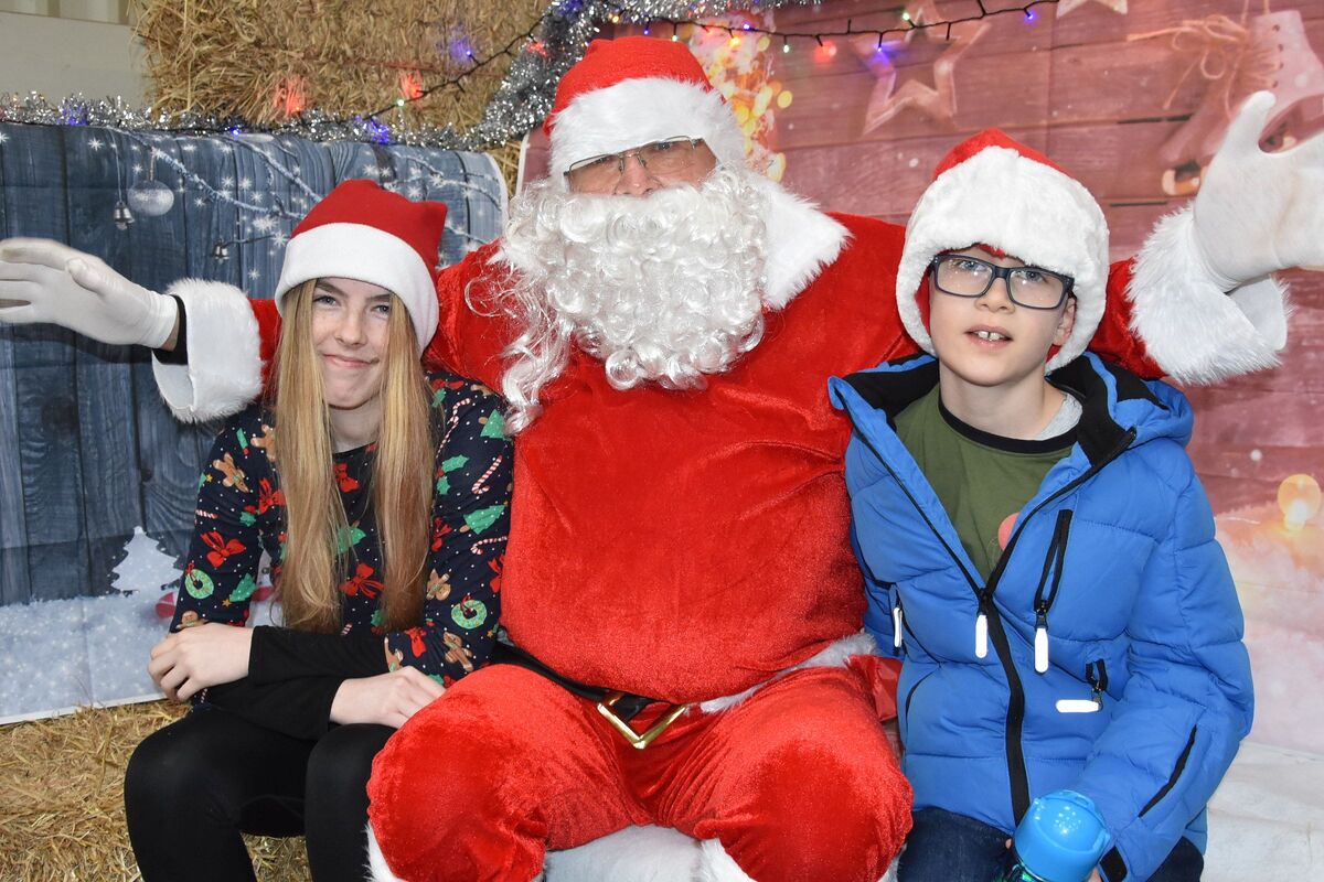 Young Oscar Smeeton of Brodick meets Santa and his helper Catherine Smith.