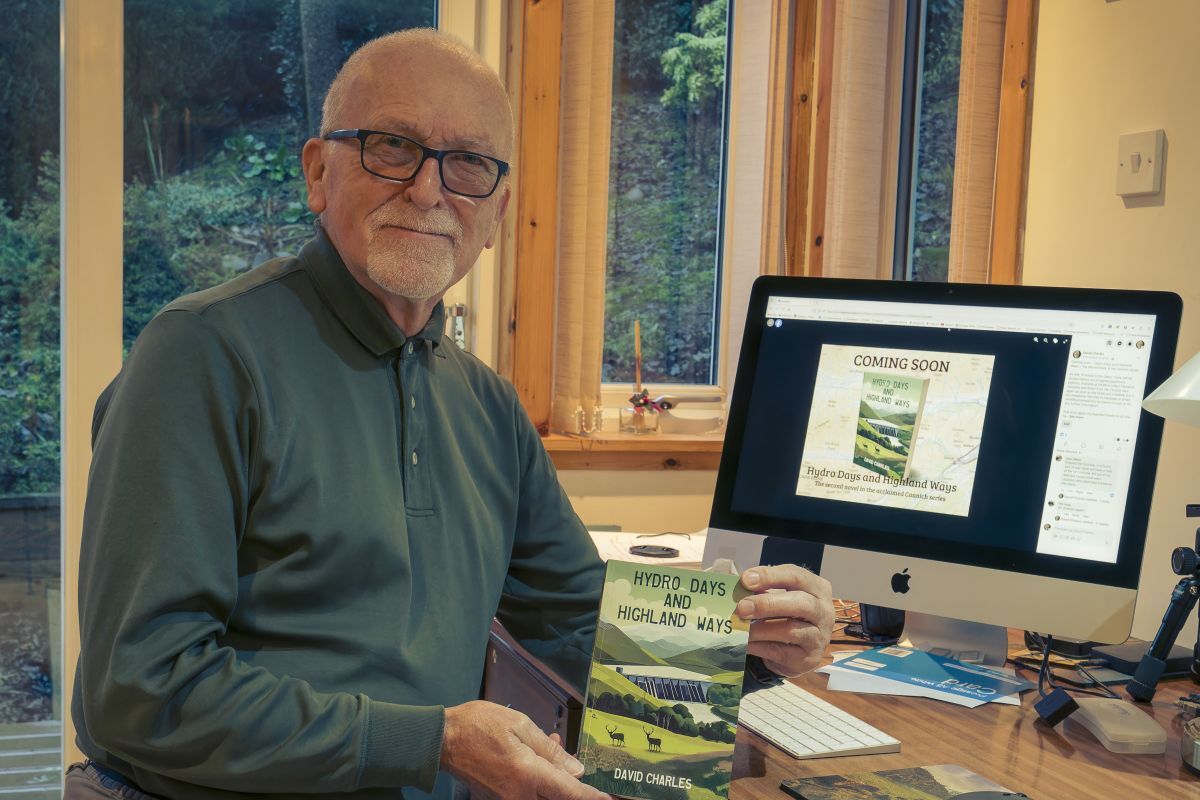 Arran author David Brookens with a copy of “Hydro Days and Highland Ways”, the second instalment in a four-part series. Photograph: David Brookens.