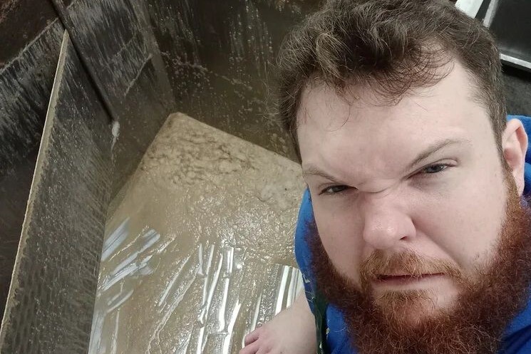 Head brewer Yorick Hinchliffe with one of the beer fermenters. Photograph: Arran Brewery.