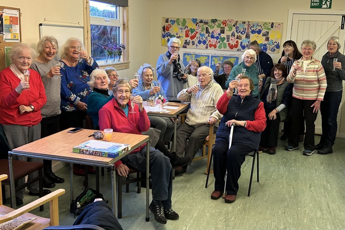 The initial committee and members raise a celebratory glass to toast the new Friendship Club. Photograph: Friendship Club.