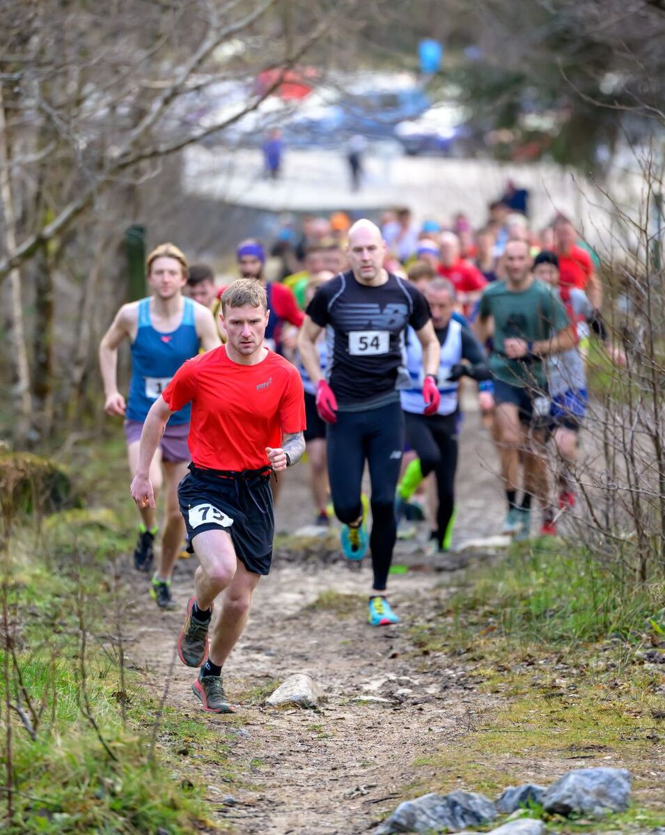 Ryan MacKay heads the pack at the start of the 12 mile Cour Loop. Photograph: Phil Hughes.