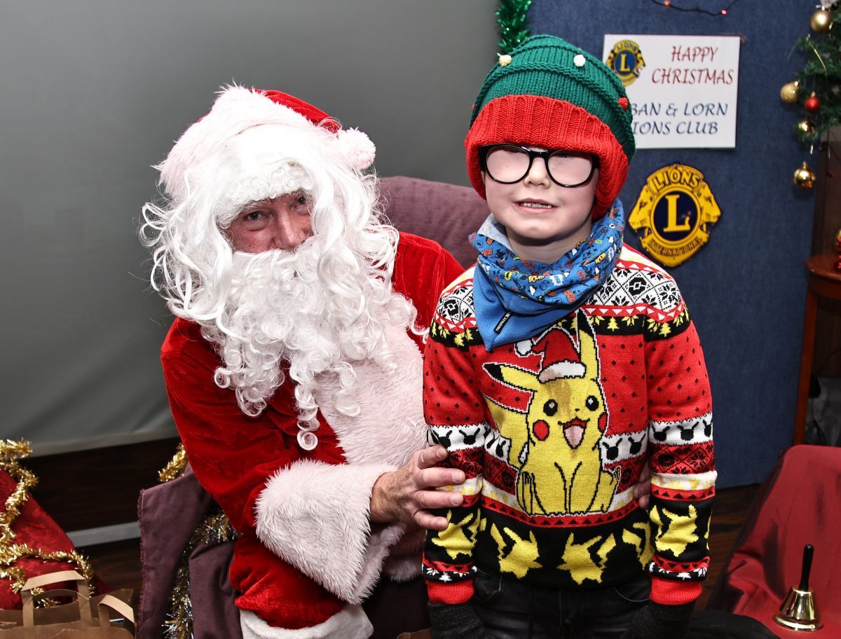 Logan Eccleston was delighted to meet Santa at Oban and Lorn Lions' festive grotto at The Royal Hotel. Photograph: Kevin McGlynn