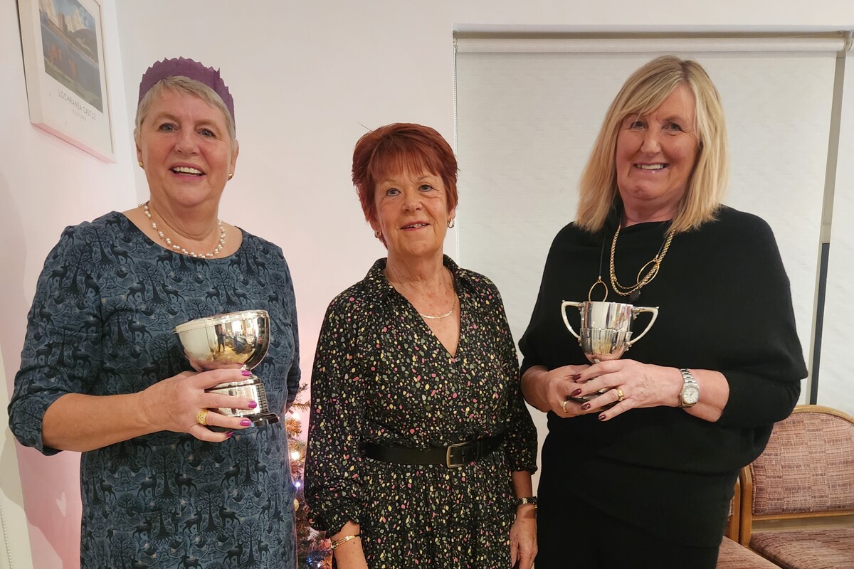 Lady captain Clare Buchanan presented Jenni Turnbull, left, with the Club Championship Trophy and Piet Johnson with the Lady Mary Eclectic Trophy at Machrie Bay Golf Club’s annual dinner.