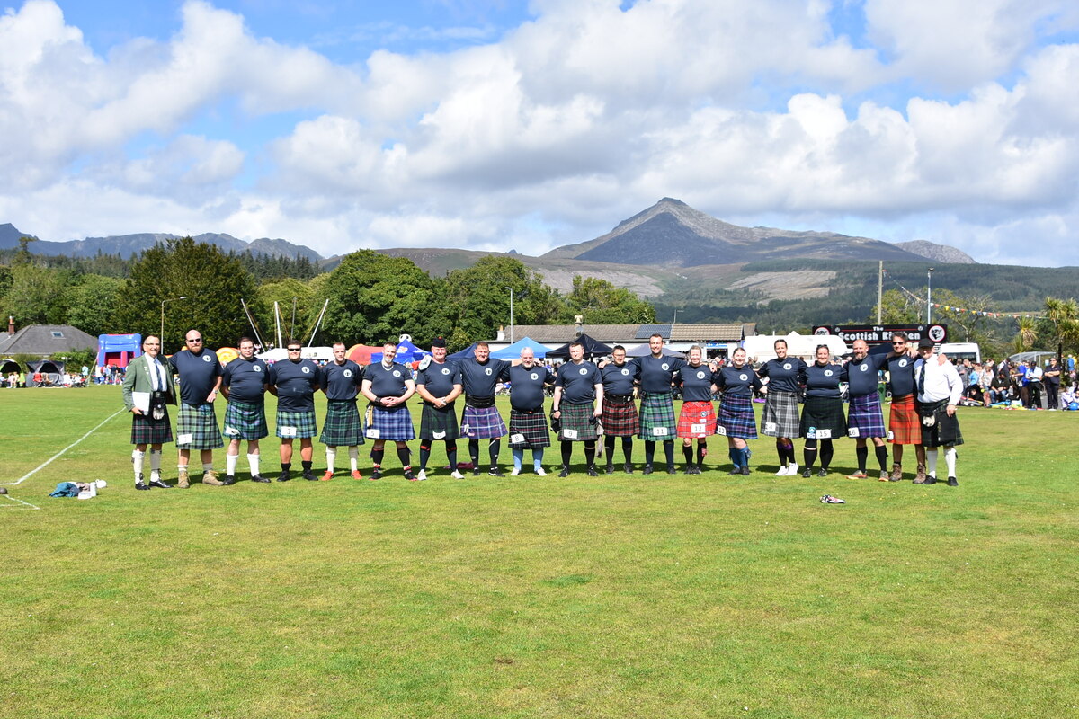 AUGUST: Heavy events competitors line up at Brodick Highland Games.