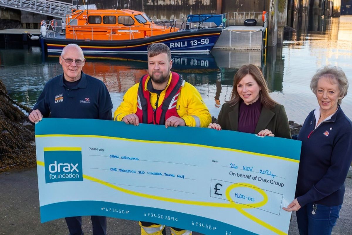 Drax’s Community Manager for Scotland, Sarah Cameron, presents Oban RNLI Station with the donation.