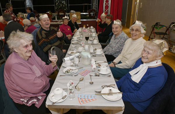 Happy smiles of anticipation as these ladies wait for Christmas lunch to be served. Photograph: Iain Ferguson, alba.photos.