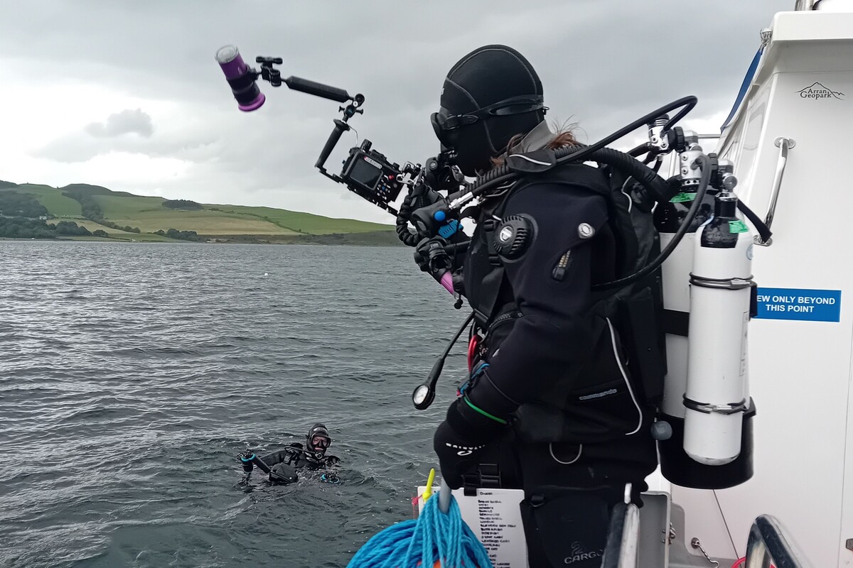 A research diver takes to the water from RV COAST Explorer. Photograph: COAST.