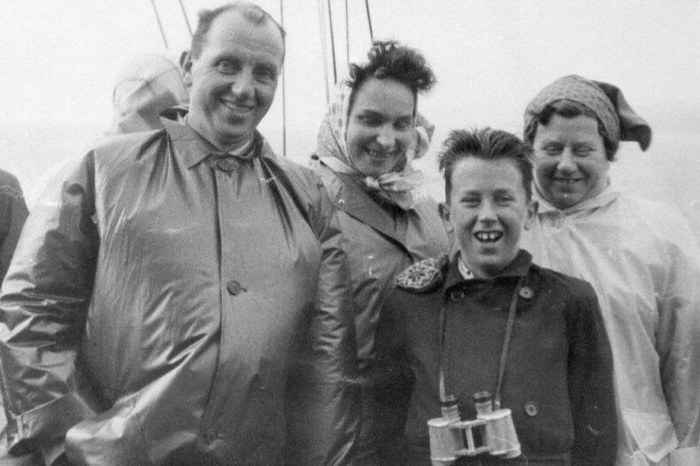 Jim Cassels in the mid 1950s during a family summer holiday cruising on the Clyde. The binoculars he is using are from the North African campaign during WW2. Photograph: Jim Cassels. 