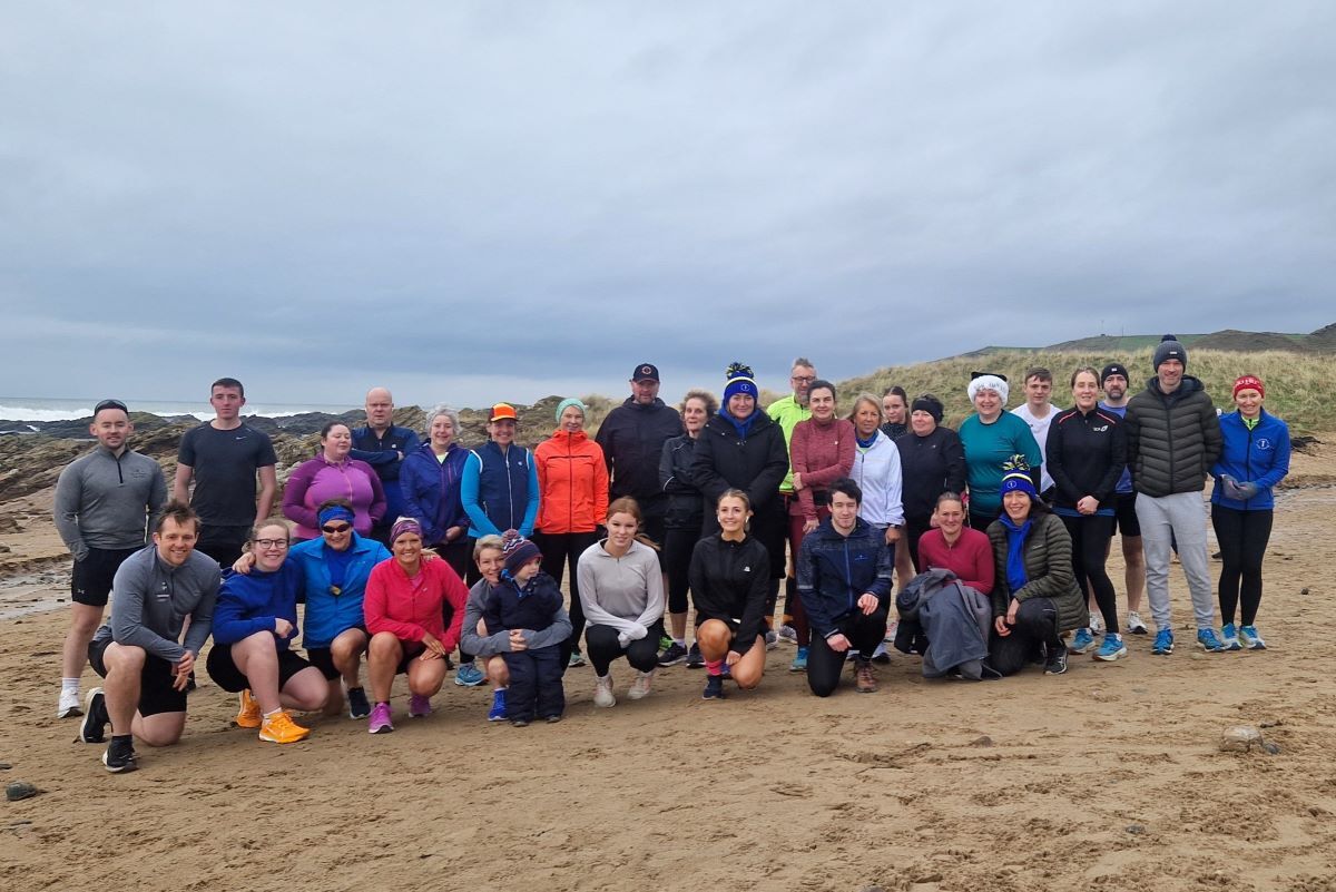 Runners slog it out on Westport beach in annual race