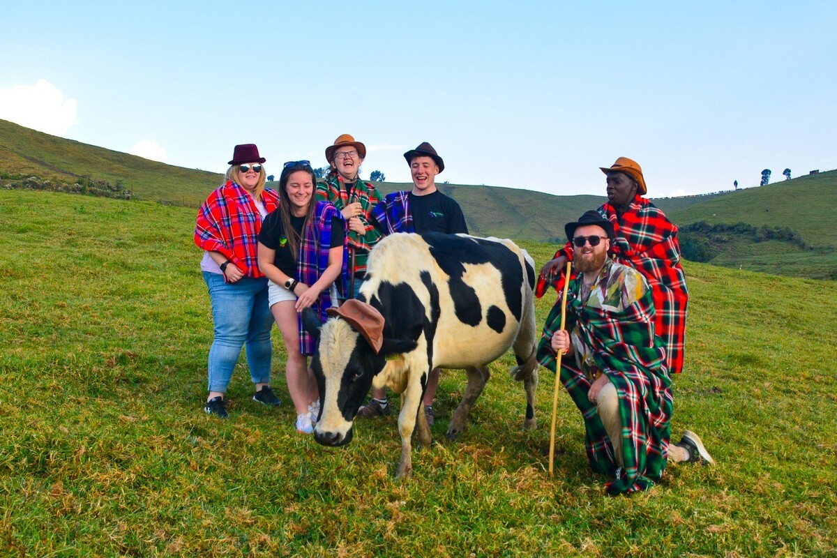 Wallace Currie, front right with cow Daisy, and previous members of the Scottish Association of Young Farmers Clubs at the Rwandan Youth Agribusiness Forum in 2015. Photograph: Wallace Currie.