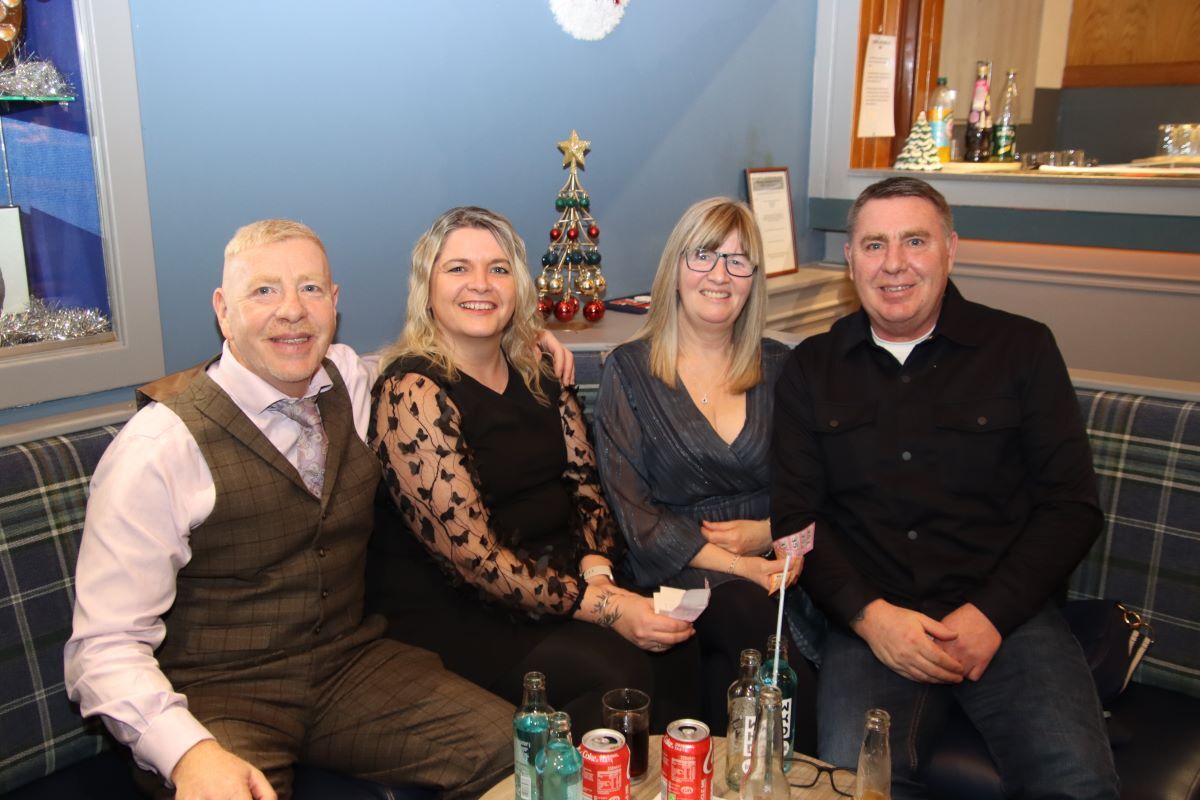 Brothers Robert Scally, left, and Stephen Scally, right, and their wives Gillian and Janna at the Masonic hall celebration. 