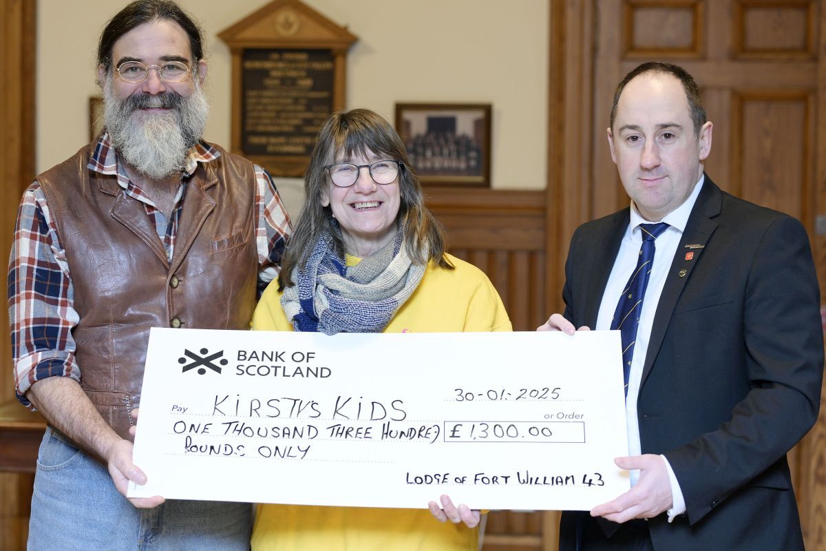  John and Jan Bryden receive a £1300 donation from Peter Kelly, right, Master of Masonic Lodge of Fort William 43. Photograph: Iain Ferguson, alba.photos