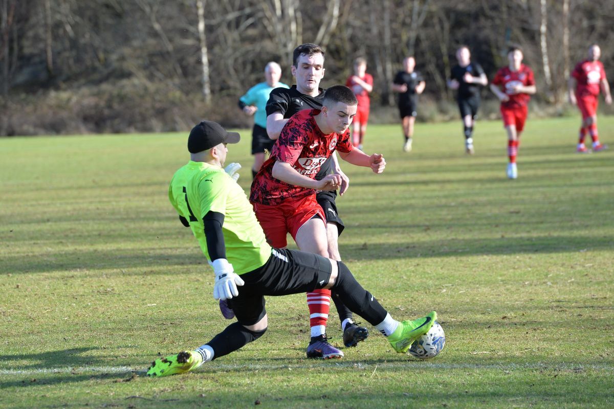 Martin Storey takes the ball off the toes of Donald Campbell. Photograph: Derek Black Martin Storey takes the ball off the toes of Donald Campbell. Photograph: Derek Black
