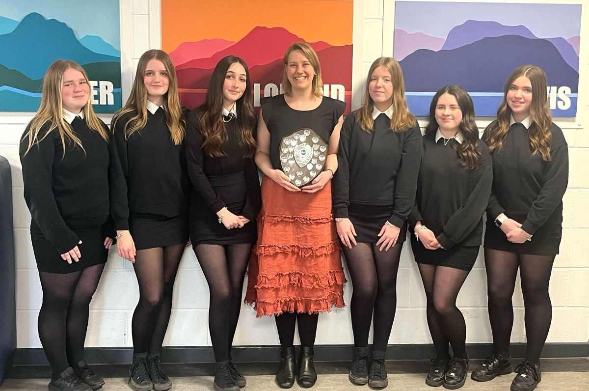 Music teacher Nickea Warrener, centre, with the winning secondary vocal ensemble, from left: Hannah Gilchrist, Ailie Renton, Isla Anderson, Brooke Coffield, Keira McSporran and Sophie Galbraith. Music teacher Nickea Warrener, centre, with the winning secondary vocal ensemble, from left: Hannah Gilchrist, Ailie Renton, Isla Anderson, Brooke Coffield, Keira McSporran and Sophie Galbraith.