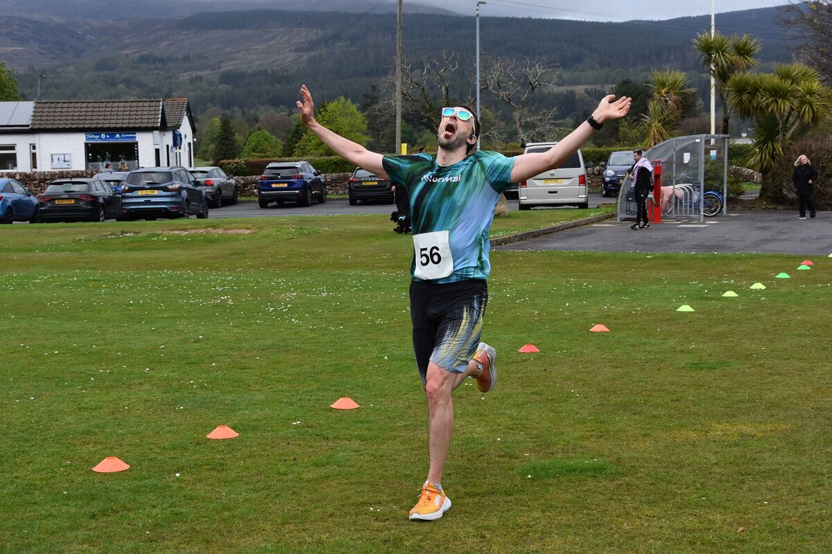 Calum Johnston crosses the finish line. Calum Johnston crosses the finish line.