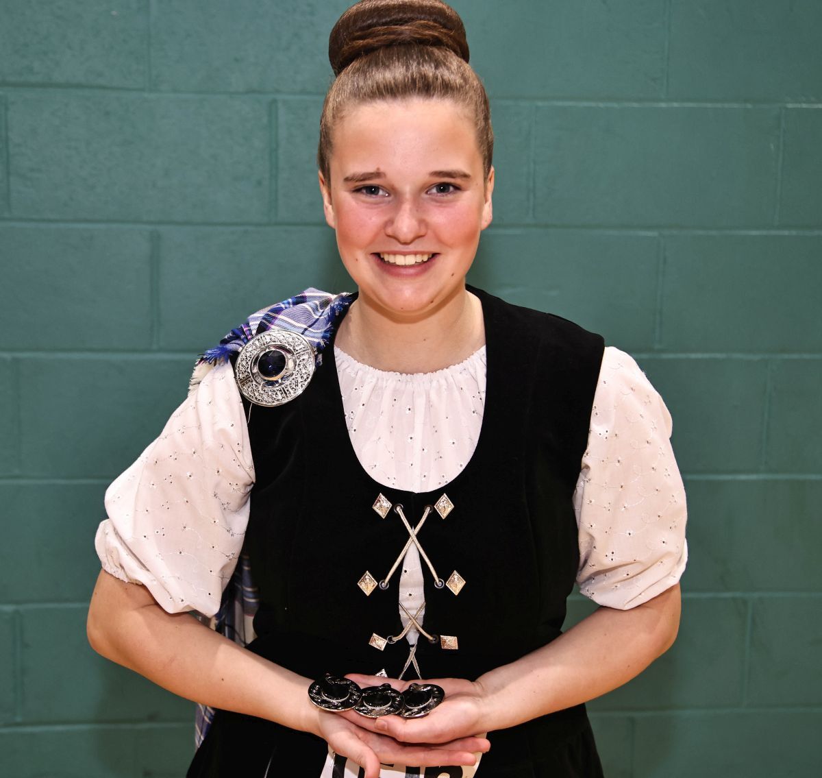 Isla Muir Oban delighted to show off her Highland Dancing medals. Photograph; Kevin McGlynn Isla Muir Oban delighted to show off her Highland Dancing medals. Photograph; Kevin McGlynn