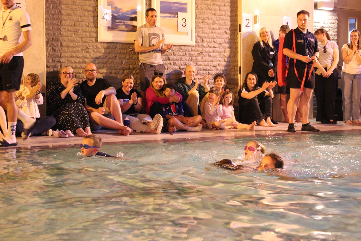 Parents cheer on the children as they compete in their age categories.