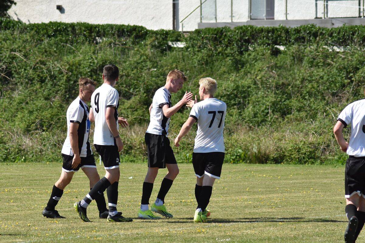 Lamlash players celebrate Kellen Craig’s goal which was the team’s third goal of the match. Lamlash players celebrate Kellen Craig’s goal which was the team’s third goal of the match.