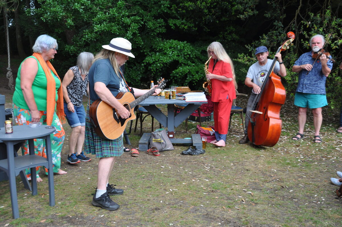 Participants enjoy a lively session at a previous Arran Folk Festival gathering at the Ormidale Hotel.
