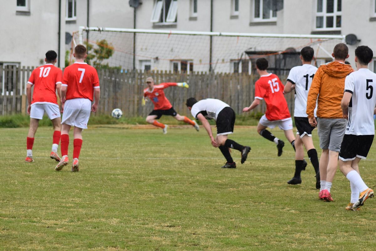 Lamlash keeper, Matt Stubbins thwarts one of Shiskine’s numerous attempts at goal. Lamlash keeper, Matt Stubbins thwarts one of Shiskine’s numerous attempts at goal.