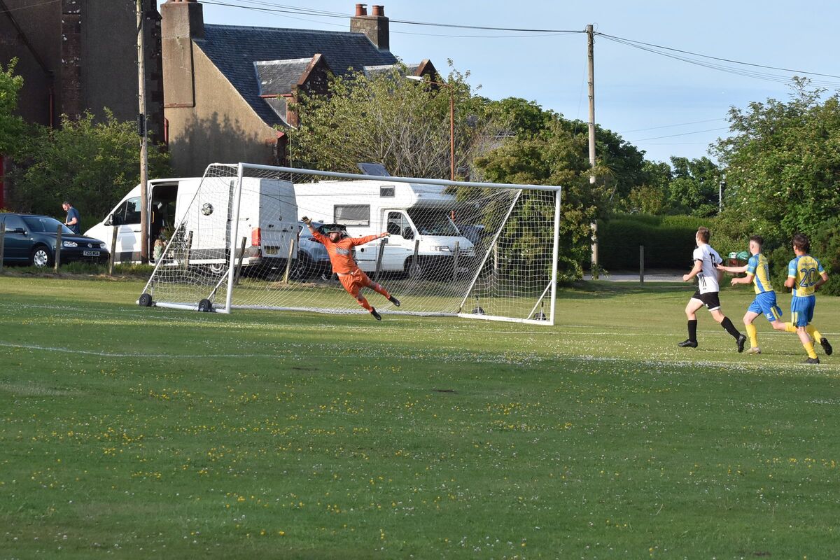 Southend keeper, Fraser Mackenzie dives to try and prevent a Lamlash goal. Southend keeper, Fraser Mackenzie dives to try and prevent a Lamlash goal.