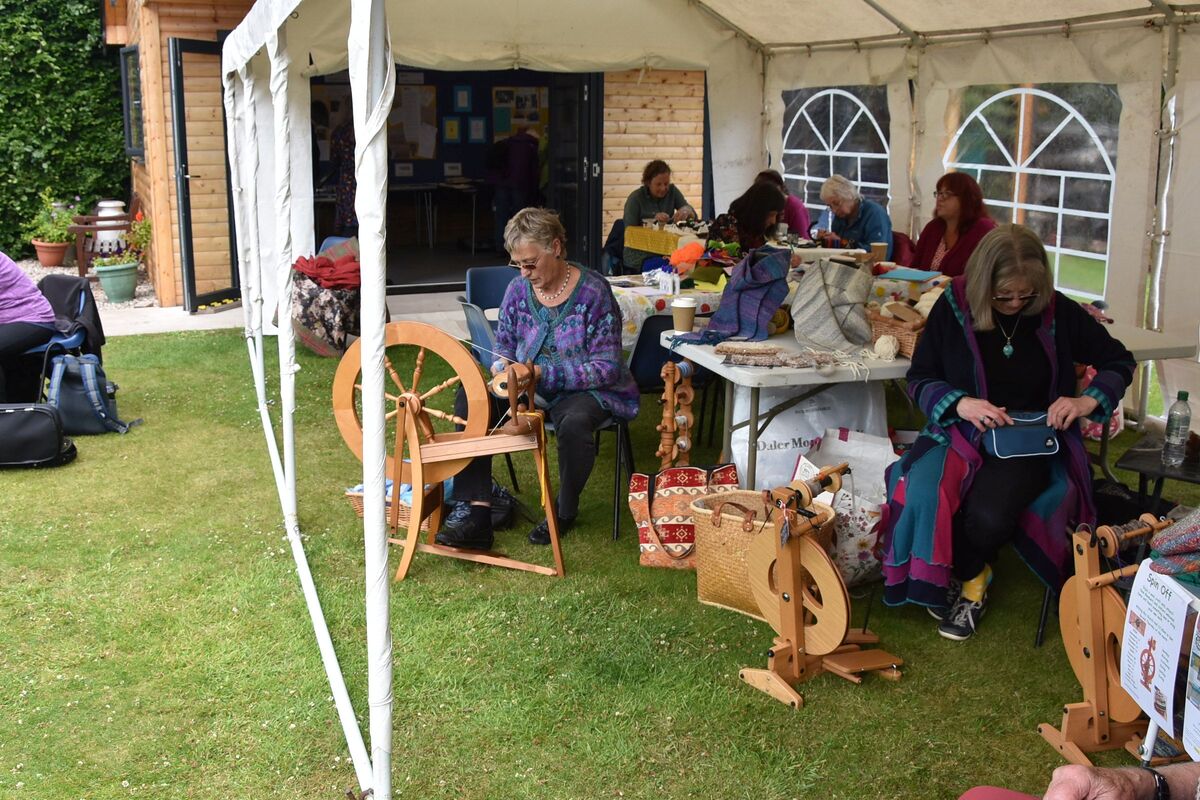 Spinners and weavers at their spinning wheels. Spinners and weavers at their spinning wheels.