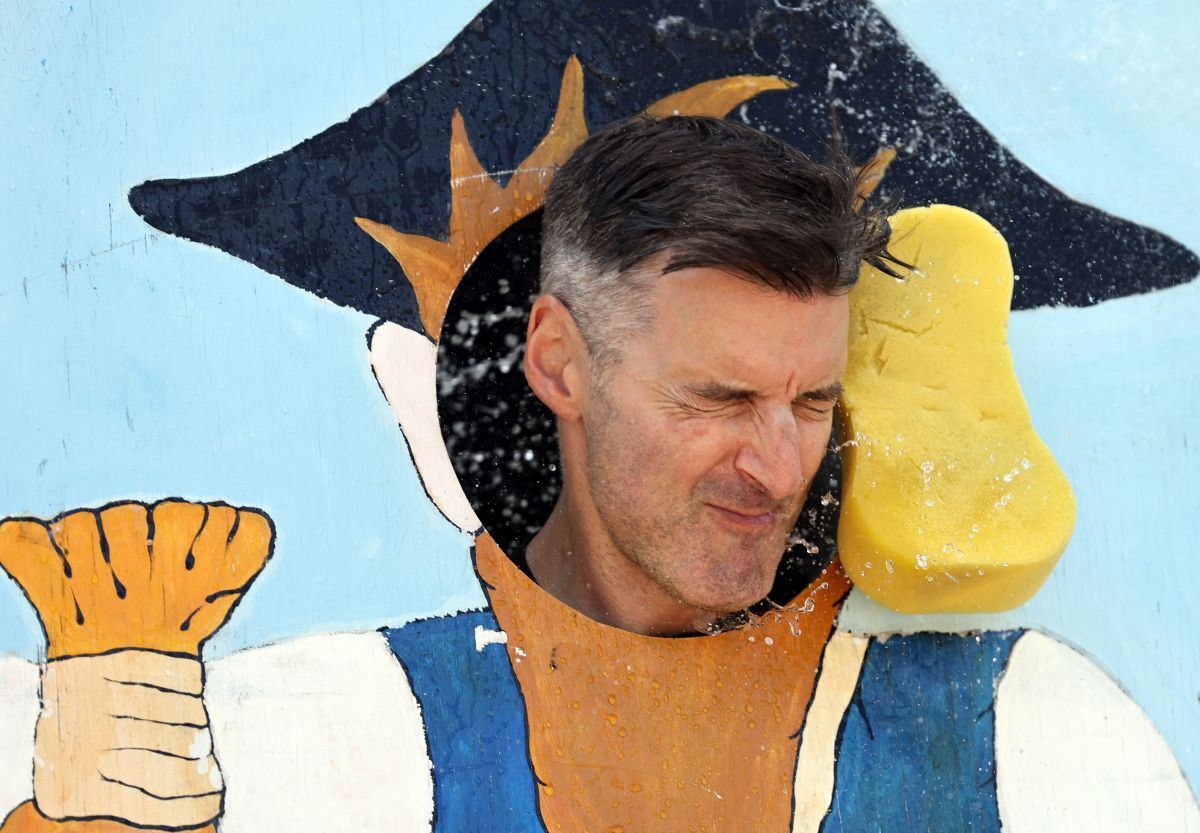 Firefighter Graham Webster takes a battering in the stocks as the kids take great delight in hitting him with sponges. Firefighter Graham Webster takes a battering in the stocks as the kids take great delight in hitting him with sponges.