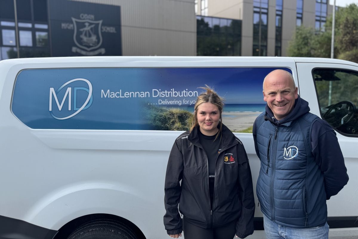 Oban Lorne RFC Modern Aprentice Aimee Clark with Stewart MacLennan, owner of MacLennan Distribution.